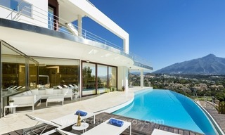 For Sale in Nueva Andalucia, Marbella: Designer Villa with panoramic golf, mountain and sea views 1