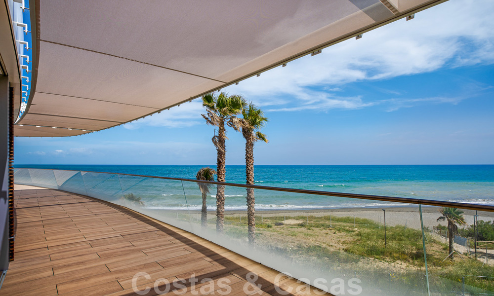 Spectacular modern luxury frontline beach apartments for sale in Estepona, Costa del Sol. Ready to move in. 27756