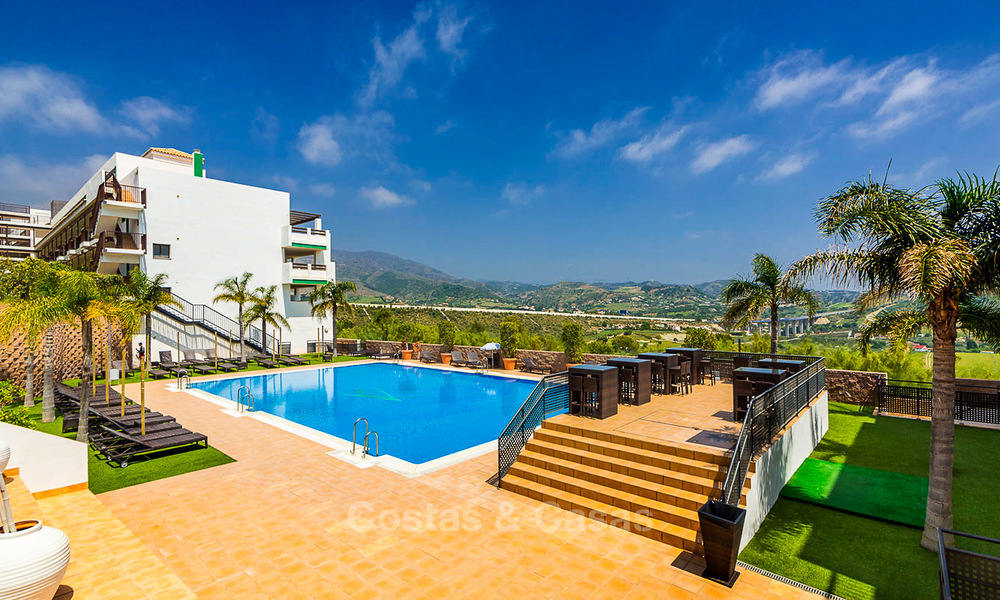 Frontline golf apartments for sale in 4-star gated holiday resort with golf-and sea views in Estepona, Costa del Sol 9914