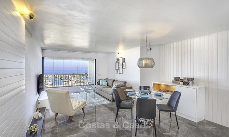 Fully renovated modern luxury apartment for sale in the marina of Puerto Banus with panoramic views over the port and the sea, Marbella. Bottom price! 12747