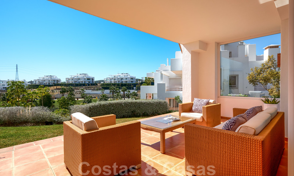 Contemporary garden corner apartment for sale in a residential development with private lagoon, Casares, Costa del Sol 23613