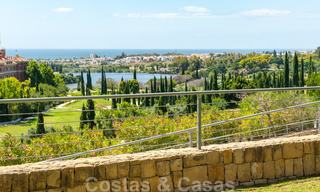 Modern front-line golf apartment with beautiful golf and sea views for sale in Los Flamingos Golf in Marbella - Benahavis 25133 