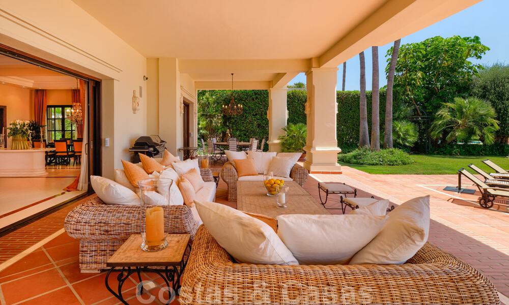 Two side-by-side luxury villas for sale on one property built in a classic Mediterranean style with stunning panoramic sea views in a gated community on the Golden Mile, Marbella 33063