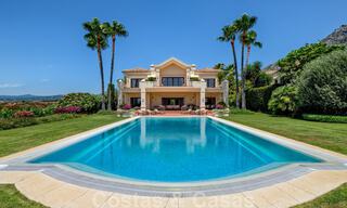 Two side-by-side luxury villas for sale on one property built in a classic Mediterranean style with stunning panoramic sea views in a gated community on the Golden Mile, Marbella 33067 