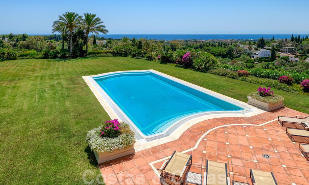 Two side-by-side luxury villas for sale on one property built in a classic Mediterranean style with stunning panoramic sea views in a gated community on the Golden Mile, Marbella 33091