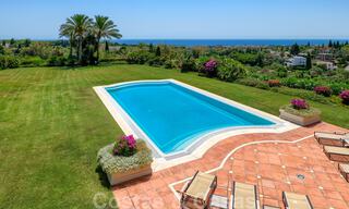 Two side-by-side luxury villas for sale on one property built in a classic Mediterranean style with stunning panoramic sea views in a gated community on the Golden Mile, Marbella 33091 