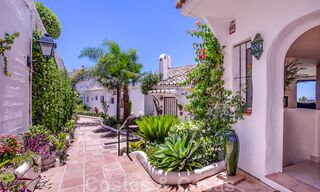 Contemporary renovated townhouse for sale in a charming white Andalucian-style urbanization with open sea views in East Marbella 43553 
