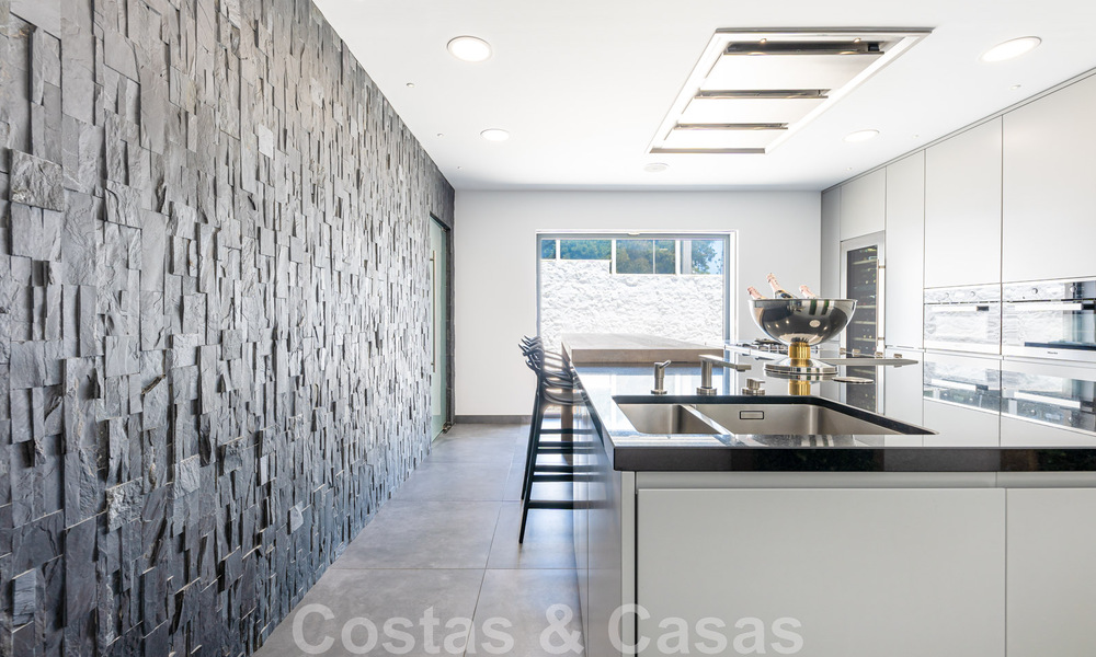 Avant-garde beach villa in a sleek modern style for sale, frontline beach in Mijas Costa, Costa del Sol 44422