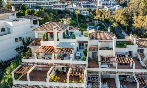 High-end duplex penthouse for sale, renovated in contemporary style, with panoramic sea views in Nueva Andalucia's golf valley, Marbella 46071