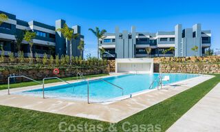 Contemporary corner apartment for sale with a large private garden on the coveted New Golden Mile between Marbella and Estepona 47155 