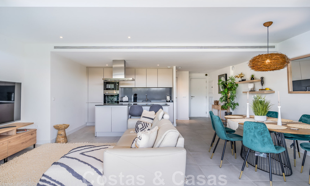 Contemporary corner apartment for sale with a large private garden on the coveted New Golden Mile between Marbella and Estepona 47162