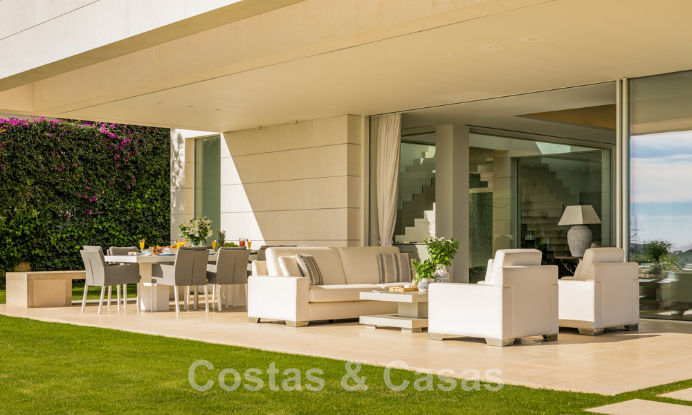 Frontline golf luxury villa in an elegant modern style with stunning golf and sea views for sale in Los Flamingos Golf resort in Marbella - Benahavis 48963