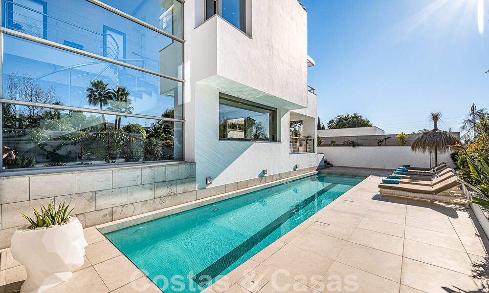 Luxury villa in contemporary architectural style for sale with sea views, located in a desirable residential area on Marbella's Golden Mile 50184