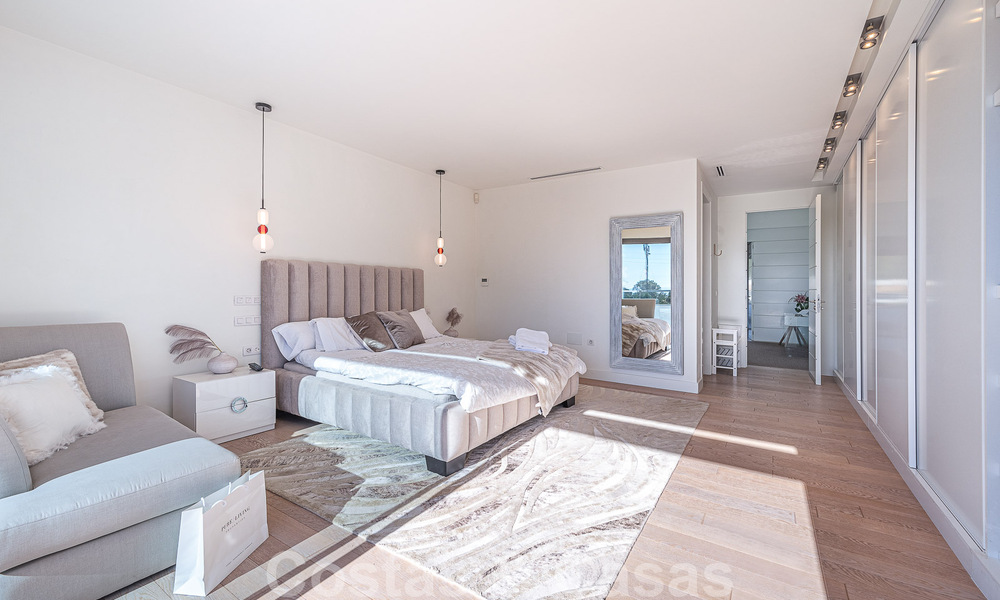 Luxury villa in contemporary architectural style for sale with sea views, located in a desirable residential area on Marbella's Golden Mile 50197