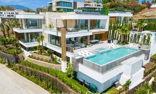 Stunning, architectural luxury villa for sale with open sea views in an elevated gated residential area in the hills of La Quinta in Marbella - Benahavis 54123 