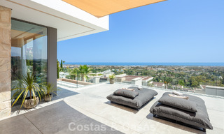 Stunning, architectural luxury villa for sale with open sea views in an elevated gated residential area in the hills of La Quinta in Marbella - Benahavis 54137 