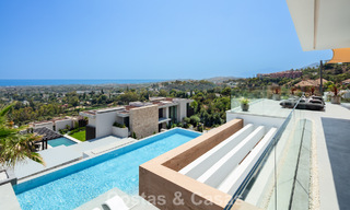 Stunning, architectural luxury villa for sale with open sea views in an elevated gated residential area in the hills of La Quinta in Marbella - Benahavis 54139 