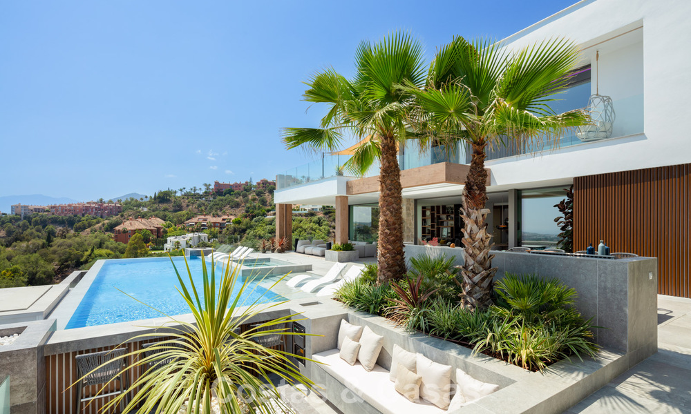 Stunning, architectural luxury villa for sale with open sea views in an elevated gated residential area in the hills of La Quinta in Marbella - Benahavis 54140