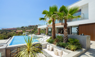 Stunning, architectural luxury villa for sale with open sea views in an elevated gated residential area in the hills of La Quinta in Marbella - Benahavis 54140 