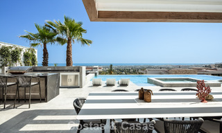 Stunning, architectural luxury villa for sale with open sea views in an elevated gated residential area in the hills of La Quinta in Marbella - Benahavis 54147 