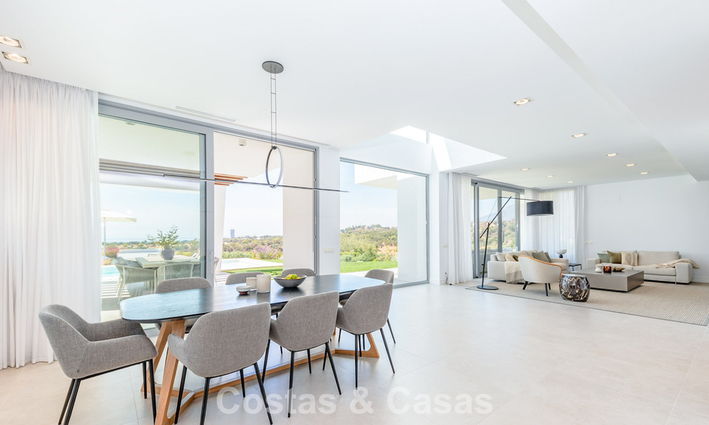 Modernist villa with sleek design and stunning sea views for sale in gated golf community in East Marbella 63594