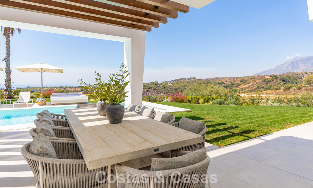 Modernist villa with sleek design and stunning sea views for sale in gated golf community in East Marbella 63595