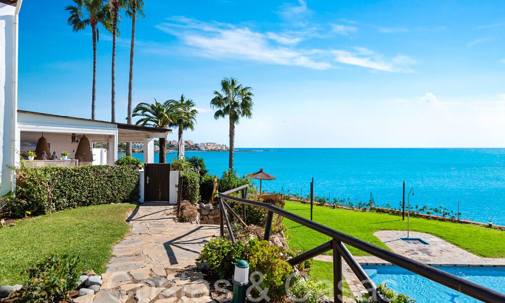 Trendy beach house for sale with stunning sea views in a first line beach complex close to Estepona town 65380