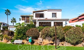 Trendy beach house for sale with stunning sea views in a first line beach complex close to Estepona town 65386 