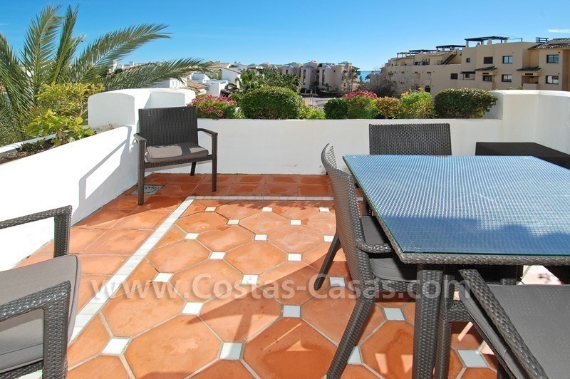 Luxury beachside apartment for sale in a frontline beach complex, New Golden Mile, Marbella - Estepona