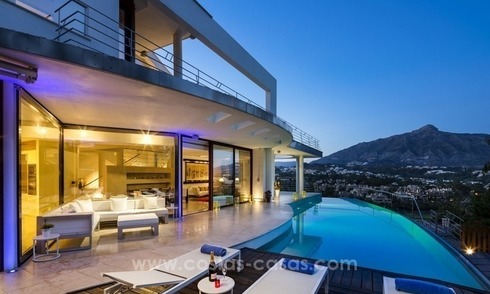 For Sale in Nueva Andalucia, Marbella: Designer Villa with panoramic golf, mountain and sea views 