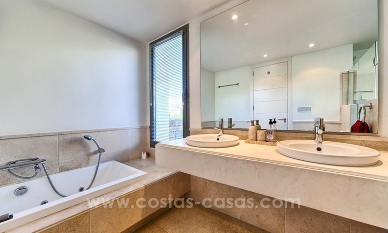 Modern luxury frontline golf ground floor apartment in a 5-star golf resort for sale in Benahavis - Marbella 11