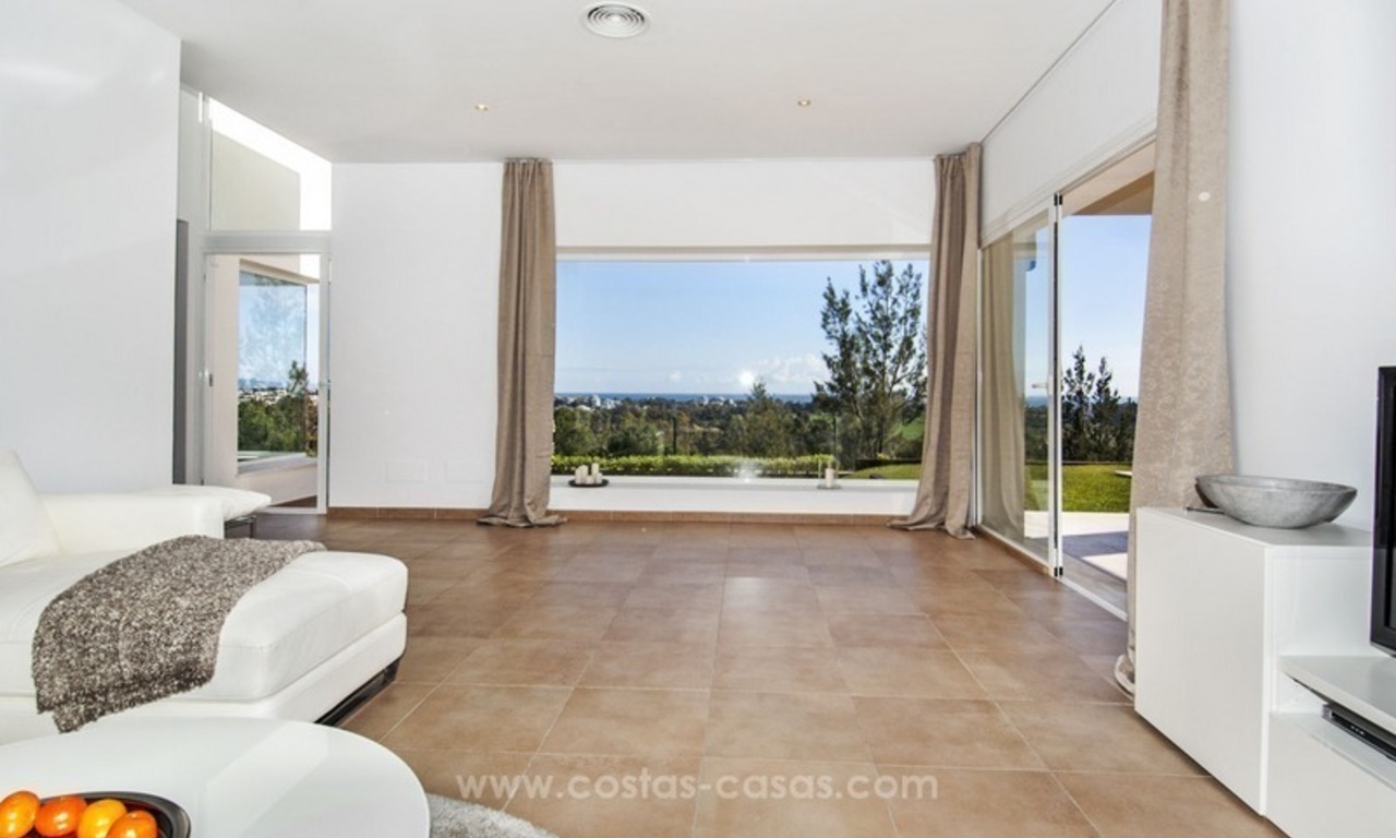 Front line golf, modern style villa for sale in Marbella - Benahavis with spectacular views to the sea, golf and mountains 12