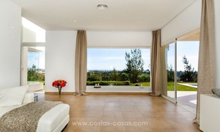 Front line golf, modern style villa for sale in Marbella - Benahavis with spectacular views to the sea, golf and mountains 13