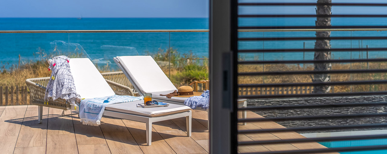 Ready to move in modern luxury front line beach villa for sale in an exclusive complex in Estepona, Costa del Sol