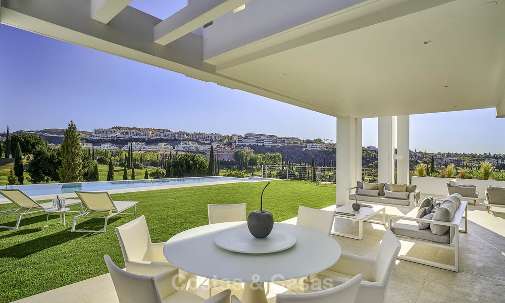 Elegant designer style villa for sale, frontline golf on a golf resort on the New Golden Mile, Marbella - Benahavis 13860