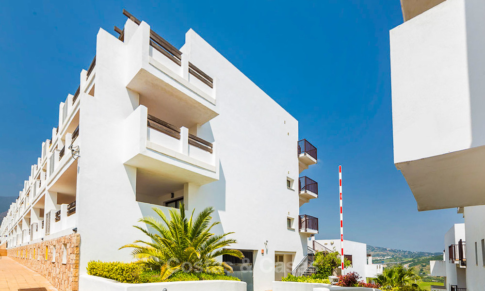 Frontline golf apartments for sale in 4-star gated holiday resort with golf-and sea views in Estepona, Costa del Sol 9900