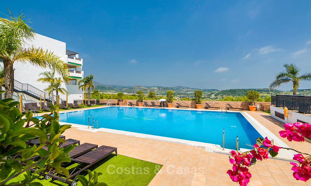 Frontline golf apartments for sale in 4-star gated holiday resort with golf-and sea views in Estepona, Costa del Sol 9902