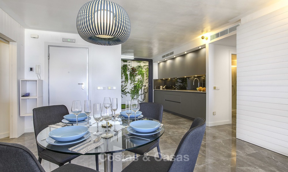 Fully renovated modern luxury apartment for sale in the marina of Puerto Banus with panoramic views over the port and the sea, Marbella. Bottom price! 12741
