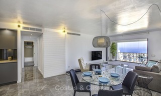 Fully renovated modern luxury apartment for sale in the marina of Puerto Banus with panoramic views over the port and the sea, Marbella. Bottom price! 12745 