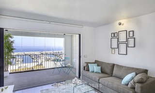 Fully renovated modern luxury apartment for sale in the marina of Puerto Banus with panoramic views over the port and the sea, Marbella. Bottom price! 12746 