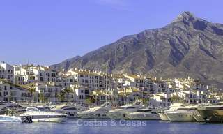 Fully renovated modern luxury apartment for sale in the marina of Puerto Banus with panoramic views over the port and the sea, Marbella. Bottom price! 12755 