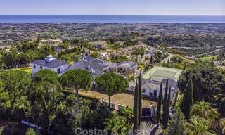 Huge Andalusian style villa with guest quarters, tennis court and unparalleled sea views for sale in El Madroñal, Benahavis - Marbella 15989 