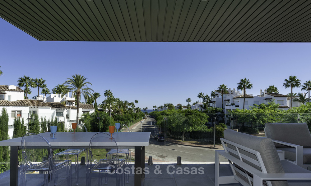 New contemporary beach side apartment with sea views for sale, short stroll to the beach, between Marbella and Estepona 16912