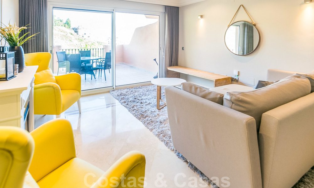 Spacious, fully renovated apartment with sea views for sale in a prestigious complex with many amenities in Nueva Andalucia, Marbella 20203