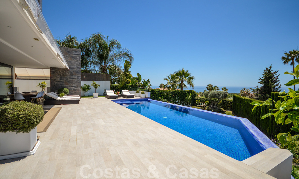 Modern luxury villa with panoramic sea views for sale in the prestigious Golden Mile of Marbella 20999