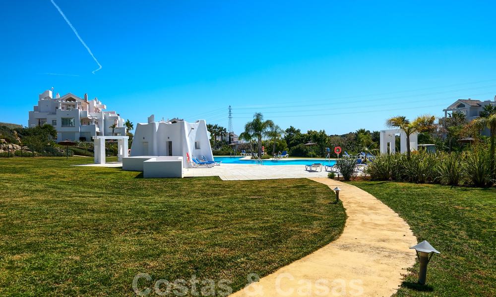 Contemporary garden corner apartment for sale in a residential development with private lagoon, Casares, Costa del Sol 23618