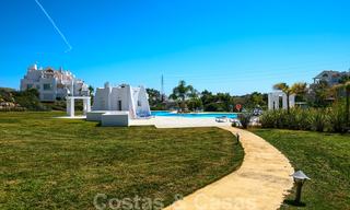 Contemporary garden corner apartment for sale in a residential development with private lagoon, Casares, Costa del Sol 23618 
