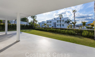 Modern design apartment for sale with spacious terrace and large garden, adjacent to the golf course in Marbella - Estepona 25404 