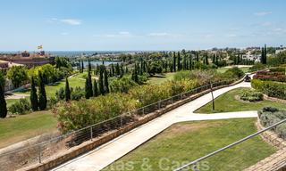 Modern front-line golf apartment with beautiful golf and sea views for sale in Los Flamingos Golf in Marbella - Benahavis 25134 