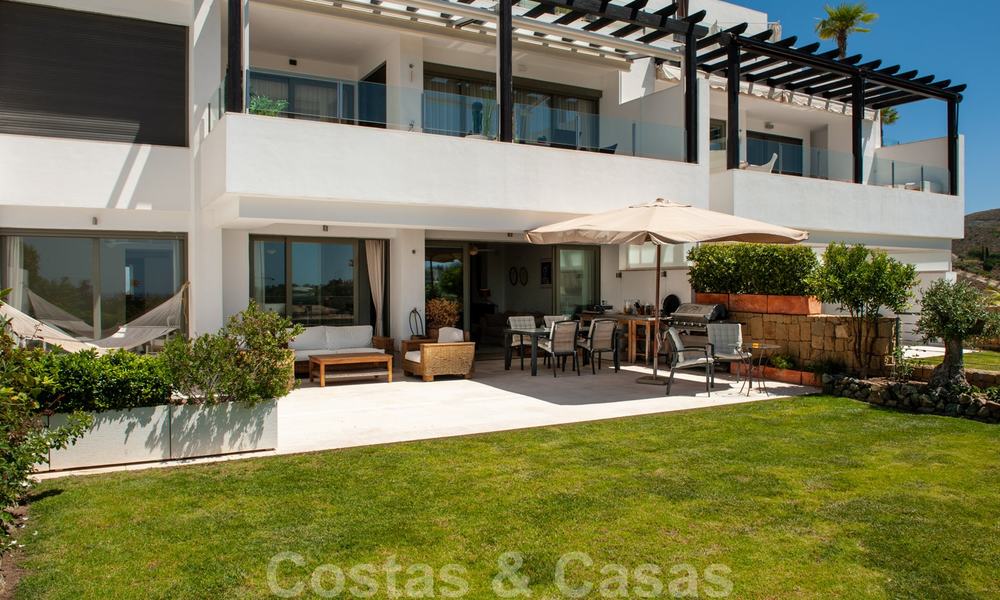 Modern front-line golf apartment with beautiful golf and sea views for sale in Los Flamingos Golf in Marbella - Benahavis 25136
